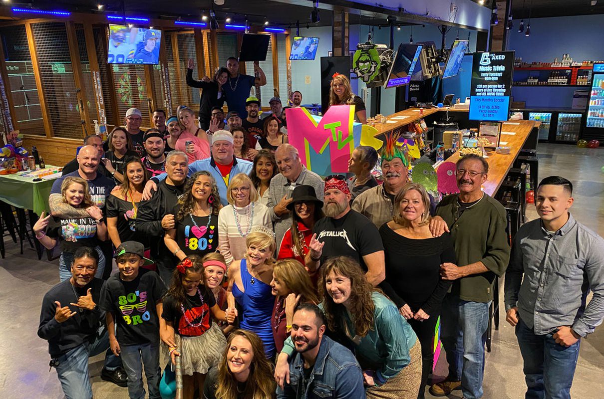 huge group of people at an axe throwing bar