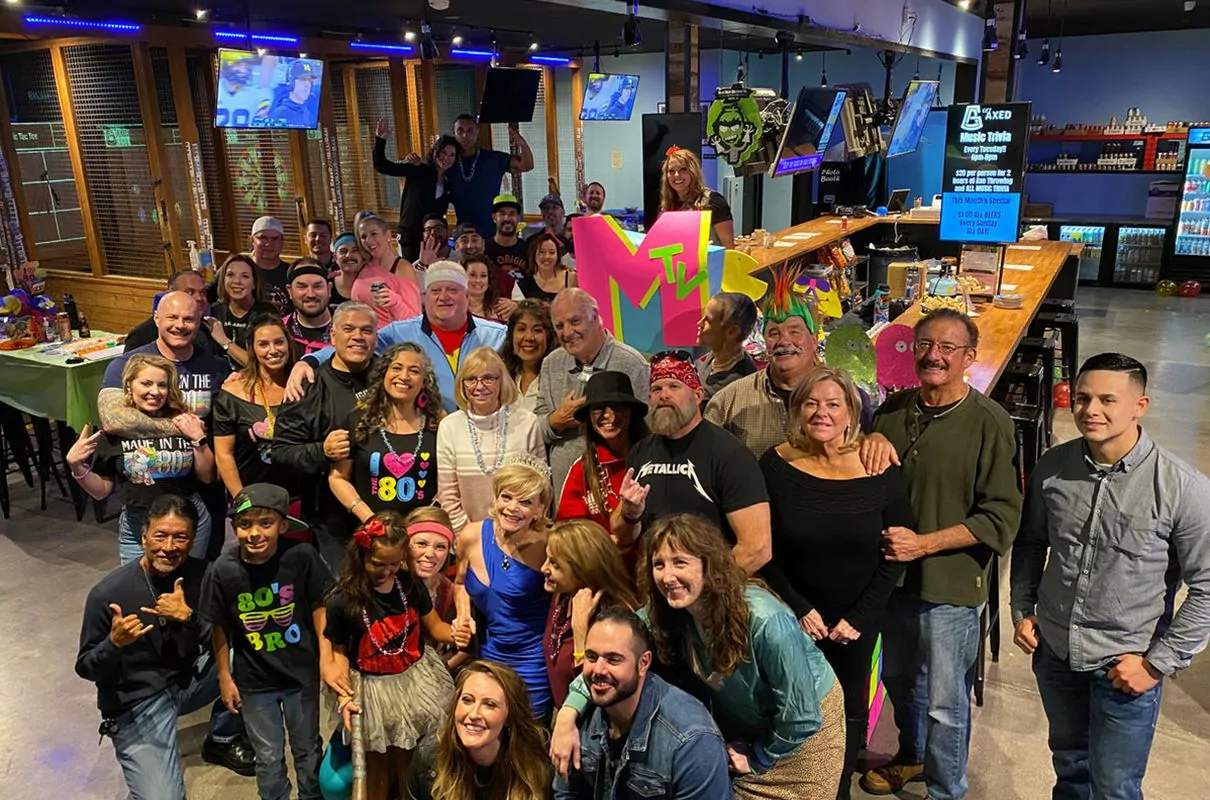 huge group of people at an axe throwing bar